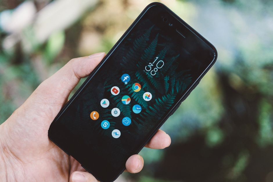 Smartphone displaying Monkey app signup screen with Slack invite dialog on a laptop